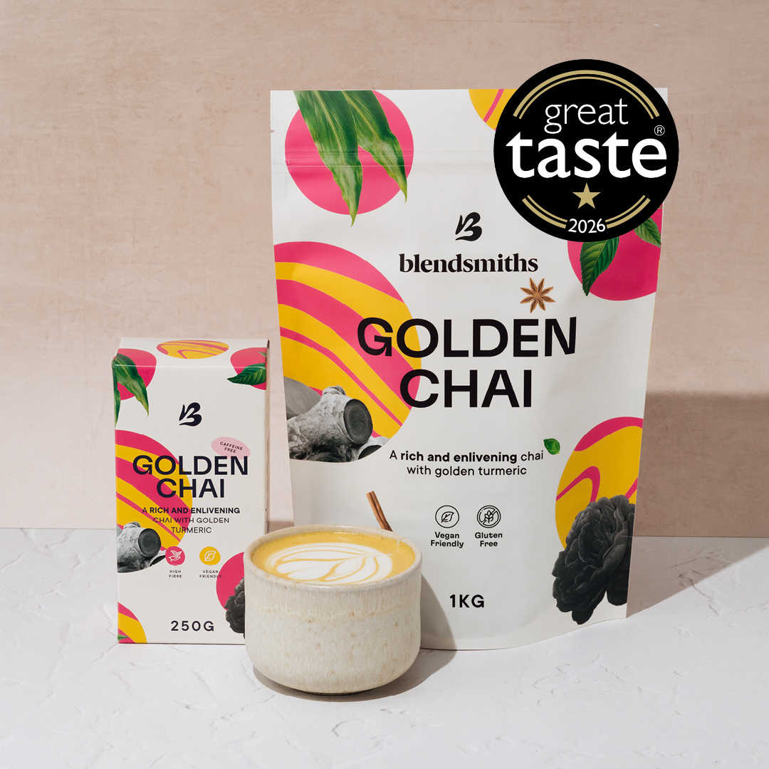 blendsmiths golden chai packaging in 1kg pouch and 250g box. The packaging is shown next to a hot golden chai latte and the image features a great taste award badge.