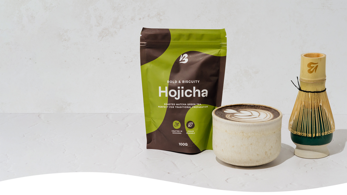 blendsmiths Hojicha latte with packaging and whisk.